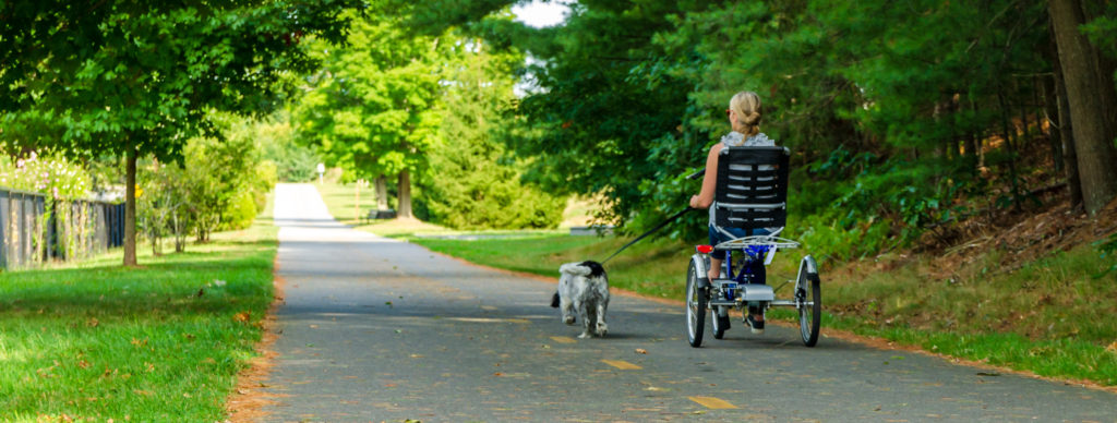 Van Raam Easy Rider with Women and Dog on bike path 
