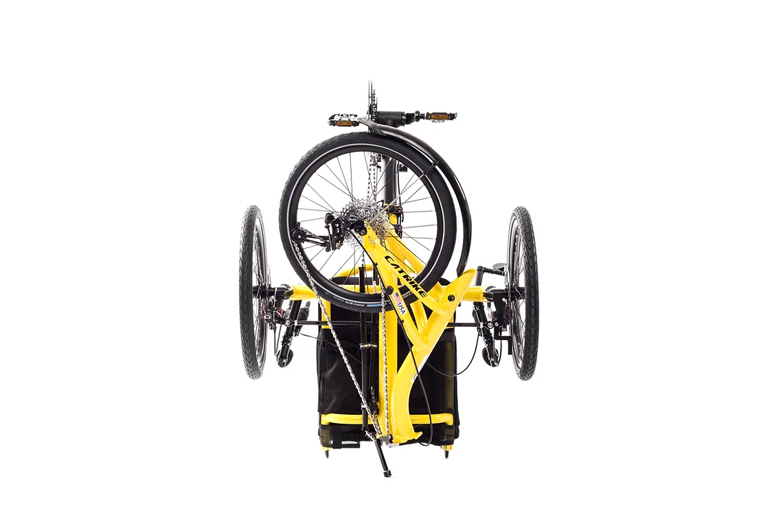 Catrike Trail recumbent trike with yellow frame in folded position