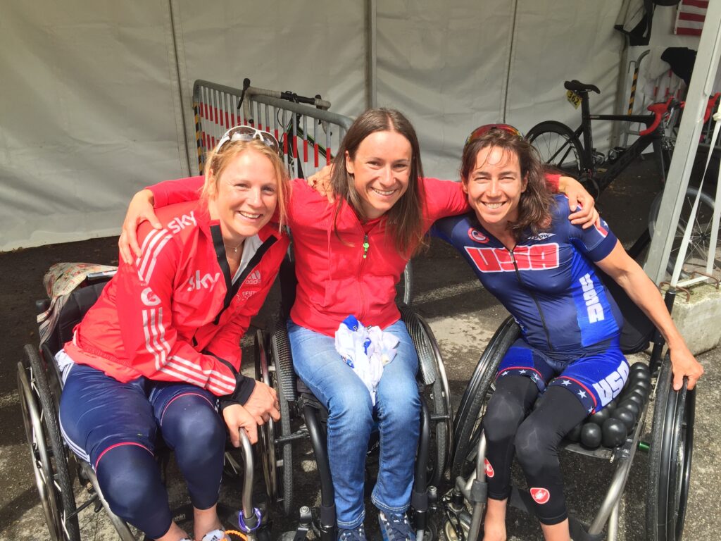 3 women in wheelchairs pose with smiling faces